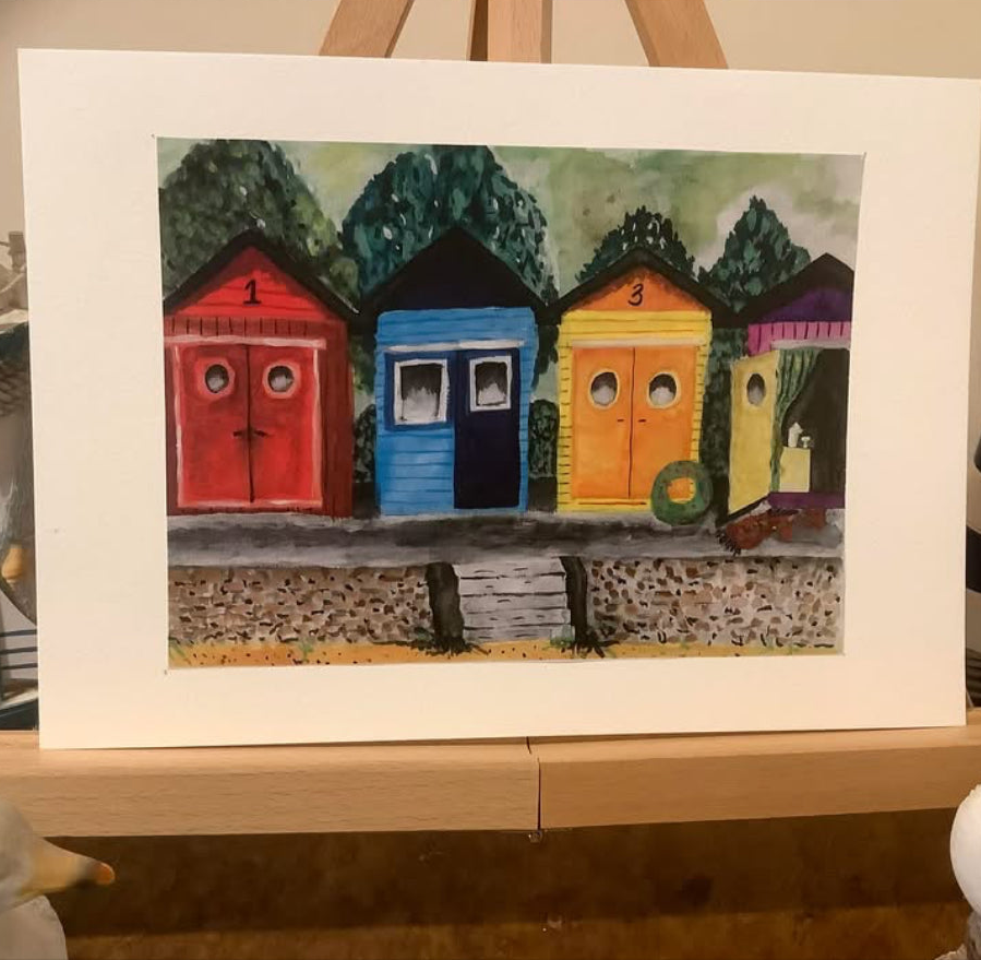 BEACH HUTS AT TWILIGHT.