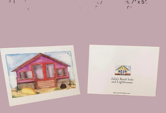 PURPLE BEACH HUT WITH BOAT AND LOBSTER POT. Greetings card